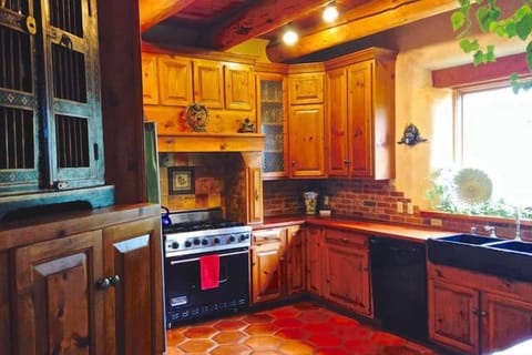 Well-appointed chef's kitchen w. Viking range and 6' picture window w. views.