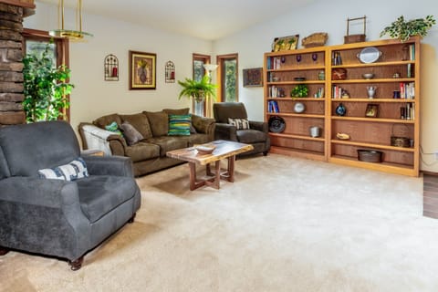 Spacious living room with large screen TV