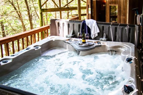 Relax in the soothing water of the hot tub.
