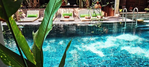 Outdoor pool, open 6 AM to 10 PM, pool umbrellas, sun loungers