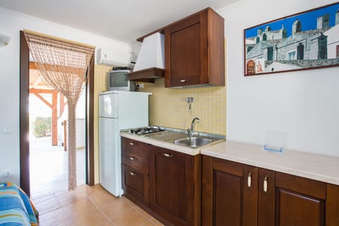 Studio (4 people) | Private kitchenette | Full-size fridge, stovetop, cookware/dishes/utensils