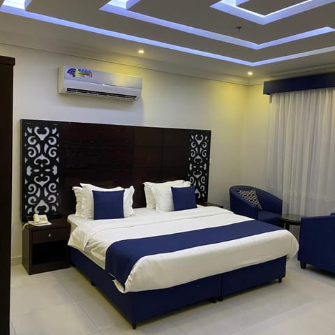 Two rooms and a hall | Premium bedding, pillowtop beds, in-room safe, blackout drapes