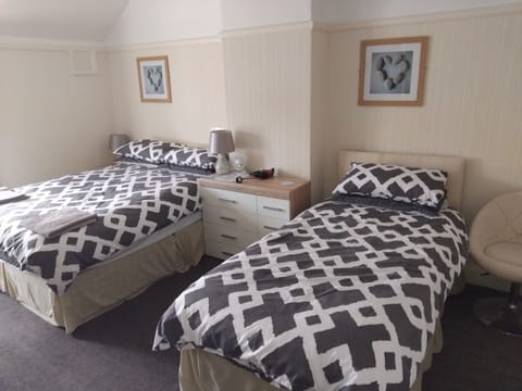 Family Double or Twin Room, Multiple Beds | Individually decorated, individually furnished, free WiFi, bed sheets