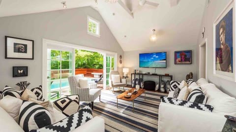 The main living area has a large sofa and chairs for the group to gather...