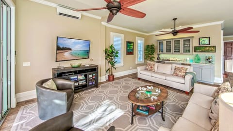 Relax on the comfortable seating options in front of the large flat screen TV...