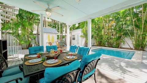 A large covered porch provides outside dining space...