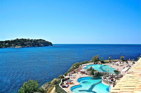 Indoor pool, outdoor pool, open 10 AM to 8 PM, pool umbrellas