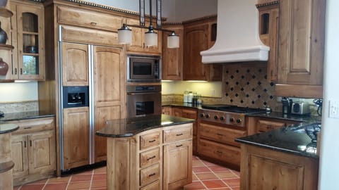 Custom designed, custom built gourmet kitchen with knotty alder cabinets
