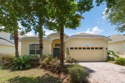 Charming home with a welcoming exterior and lush greenery.