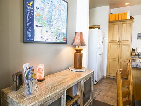 Interior Dining Area with Refrigerator - Interior dining area side table/shelf with Refrigerator in background.
