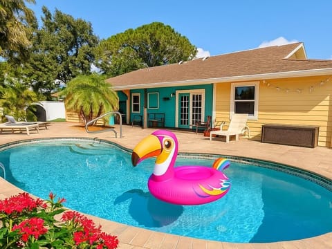 Sunny backyard with private pool and vibrant lounge area
