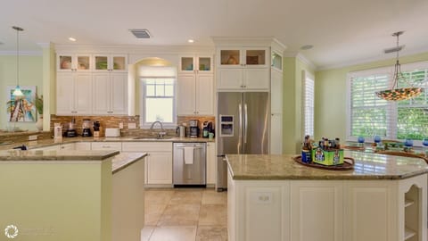 The kitchen is equipped with top of the line appliances and everything else, too...