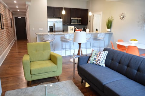 Large living space opens to breakfast bae and kitchen