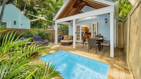 SWEPT AWAY is a meticulously renovated two bedroom home with a mix of classic Key West and a new coastal style...