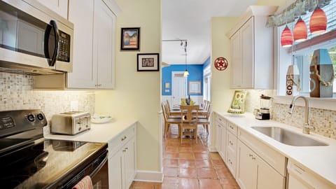 The fully equipped kitchen sits off the living area...