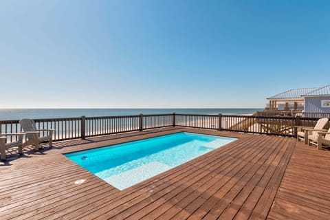 Private pool set on an expansive deck with sweeping Gulf views. Ideal for lounging, swimming, and enjoying Dauphin Island sunsets just steps from the beach.