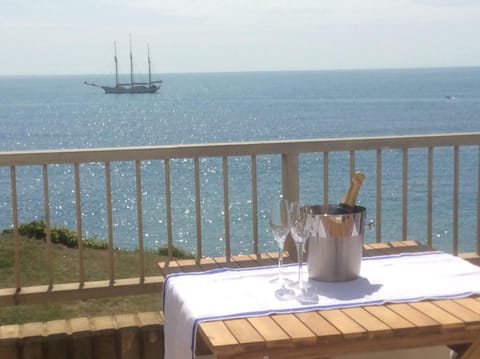 Front balcony with stunning views, dining table, chairs and quality sunloungers