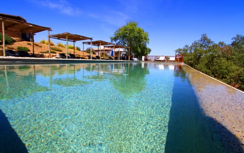 2 outdoor pools, open 8 AM to 8 PM, pool umbrellas, sun loungers