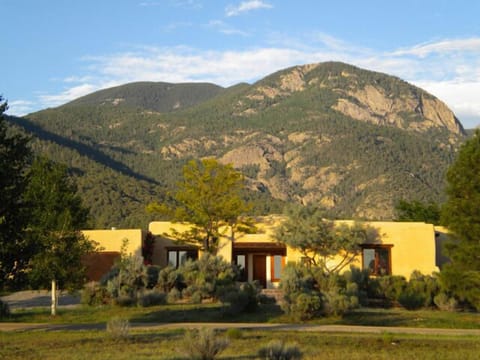 Exterior front view with Taos Mountain background