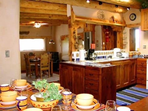 Great Room kitchen between two dining areas and 'Banco Bed'