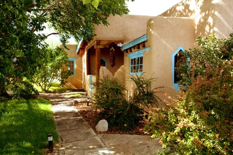 Peaking through wooden gate to front entry