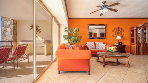 The living room flows naturally onto the expansive balcony via sliding glass doors.