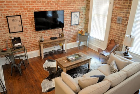 Wall mount TV with Roku streaming device in Guest Mode so you can sign into your own subscriptions