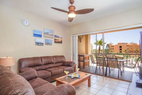 Leather sofas make the living room extra cozy in this two bedroom condo, Princesa B 306.