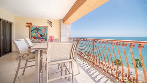 Relax on your private patio with stunning ocean views. This inviting outdoor space features a cozy table and chairs—perfect for morning coffee or sunset dining by the sea.
