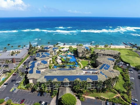 Aerial view of Waipouli Beach Resort with pools and ocean