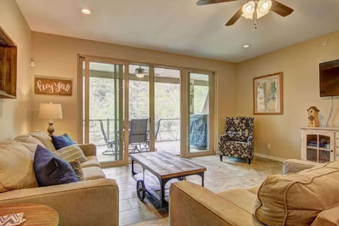 The cozy living room is a great spot for watching movies after an exhausting day on the river. 