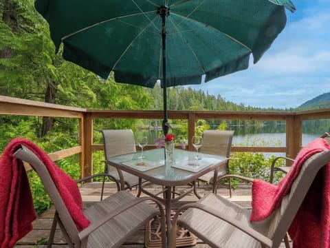 Outdoor dining space on your own private deck overlooking the lake. 
