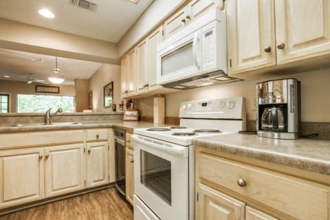 The full sized kitchen comes fully stocked with all utensils, pots, pans, plates, and bowls.
