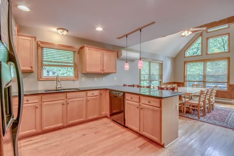 Interior of kitchen, showing off island and dining room