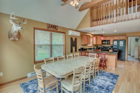 dining room table and mounted deer head on wall