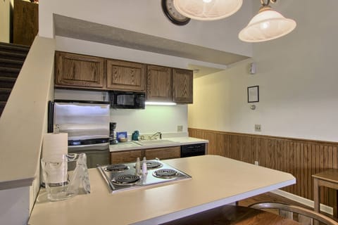 Kitchen - This kitchen has a full-sized fridge, stove, microwave, dishwasher, toaster and coffee maker