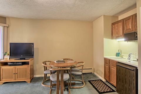 Kitchenette - Combined with the living room, this unit also includes a kitchenette area with a dining table with four chairs. The kitchenette has a small fridge, sink, coffeemaker, toaster and microwave.