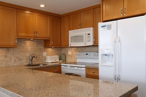 Fully equipped kitchen with new appliances and granite counters