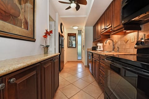 Looking back towards entry door, nice jalousie window allows for more fresh air.