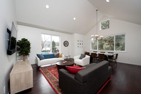 Living room with TV and dining area