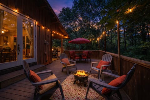Gather around your private fire pit as twilight paints the sky, with twinkling lights and forest views creating the perfect evening retreat.