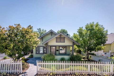Welcoming front porch and picket fence set the tone