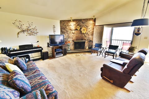 Living Room with Wood Fireplace - Living Room with Wood Fireplace