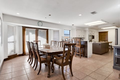 Large table seats 10, bar seats 3, double doors open to 6 person patio table.