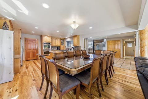 Bright dining area with seating for ten and beautiful waterfront views