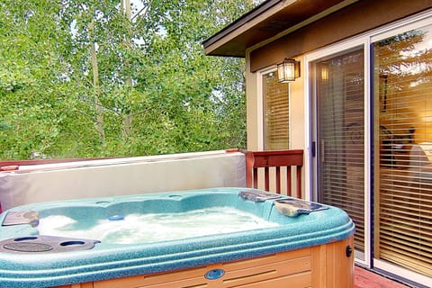 The patio has a grill and its own private hot tub