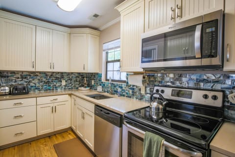 Mermaid's Folly features a fully renovated kitchen with new cabinets, backsplash and counters.
