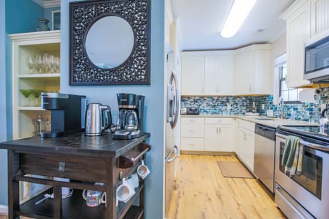 There is a coffee bar situated in between the kitchen and dining room.