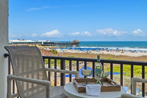 View from your balcony overlooking the ocean and pool