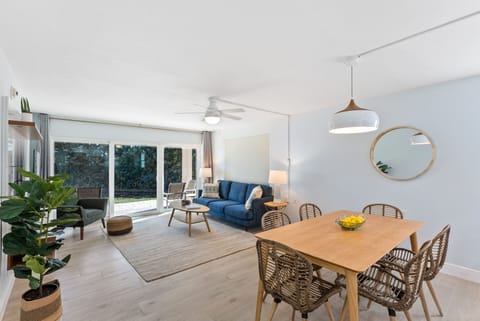 Cozy living space with an open flow to the outdoor patio, blending comfort and style.